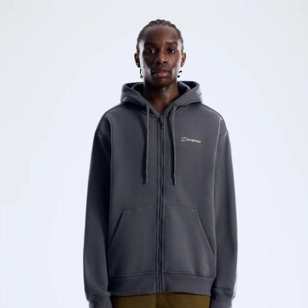 Berghaus 'Dark Grey' Logo Zip-Up Hoodie for men, front view on model of dark grey full-zip hoodie with drawcord hood, front pockets and small Berghaus logo on the chest, part of the 'Dark Grey' Logo Zip-Up Hoodie, Tee & Cargo Pant Tracksuit
