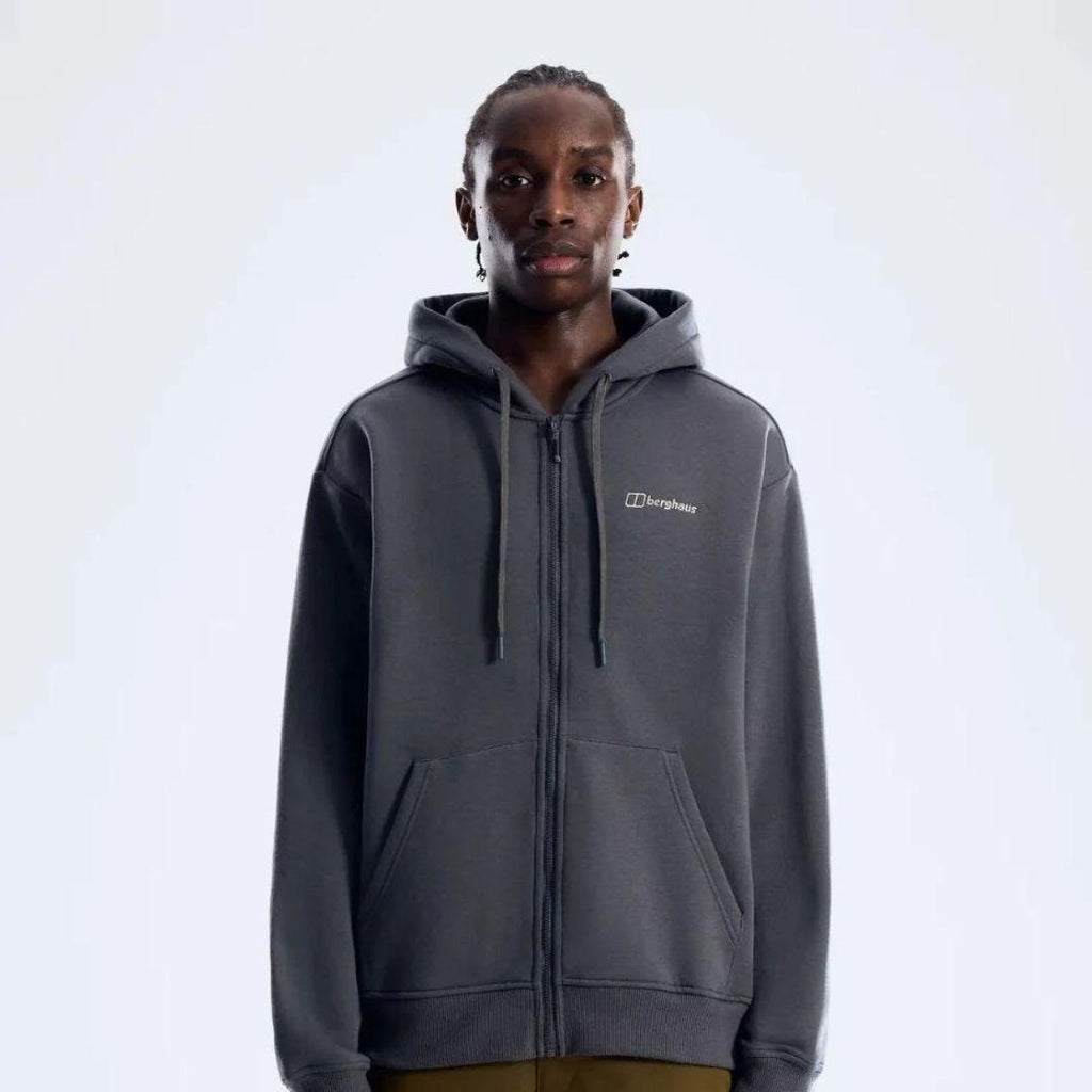 Berghaus 'Dark Grey' Logo Zip-Up Hoodie for men, front view on model of dark grey full-zip hoodie with drawcord hood and small Berghaus logo on the chest, part of the 'Dark Grey' Logo Zip-Up Hoodie & Cargo Pant Tracksuit