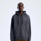 Berghaus 'Dark Grey' Logo Zip-Up Hoodie for men, front view on model of dark grey full-zip hoodie with drawcord hood and small Berghaus logo on the chest, part of the 'Dark Grey' Logo Zip-Up Hoodie & Cargo Pant Tracksuit