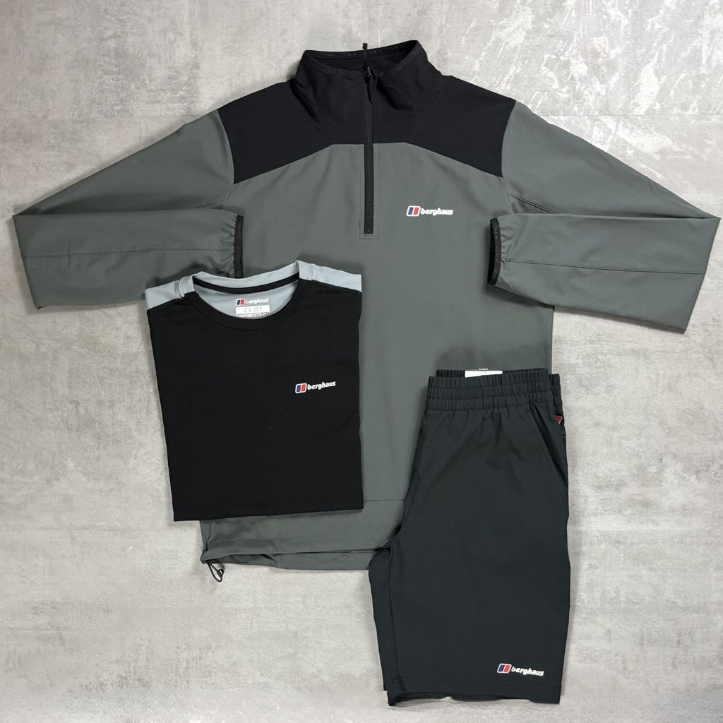 Gray and black tracksuit with Berghaus logo on a gray surface