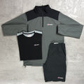 Gray and black tracksuit with Berghaus logo on a gray surface