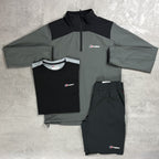 Gray and black tracksuit with Berghaus logo on a gray surface