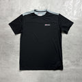 Black t-shirt with a Berghaus logo on a gray textured background