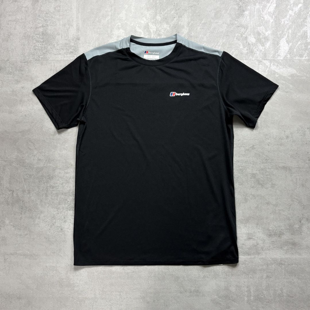 Black t-shirt with a Berghaus logo on a gray textured background
