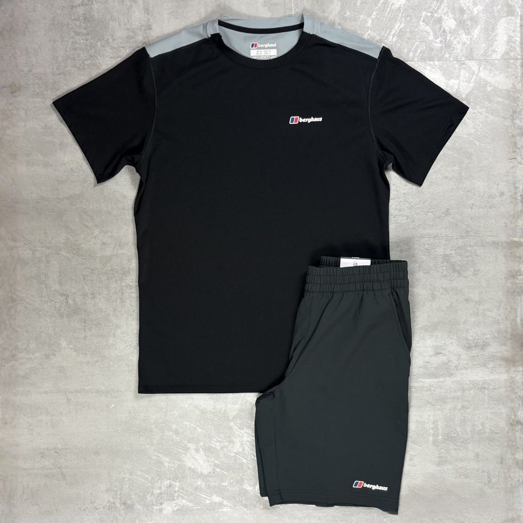 Black t-shirt and shorts set with Berghaus logo on a grey surface