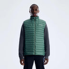 Berghaus Green Vaskye Gilet for men, front view on model of green quilted gilet with stand collar, full-zip front and Berghaus logo on the chest, worn over a dark long-sleeve top