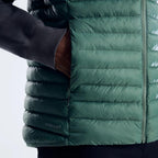 Berghaus Green Vaskye Gilet for men, close-up on model of the zipped hand pocket and quilted body of the green gilet
