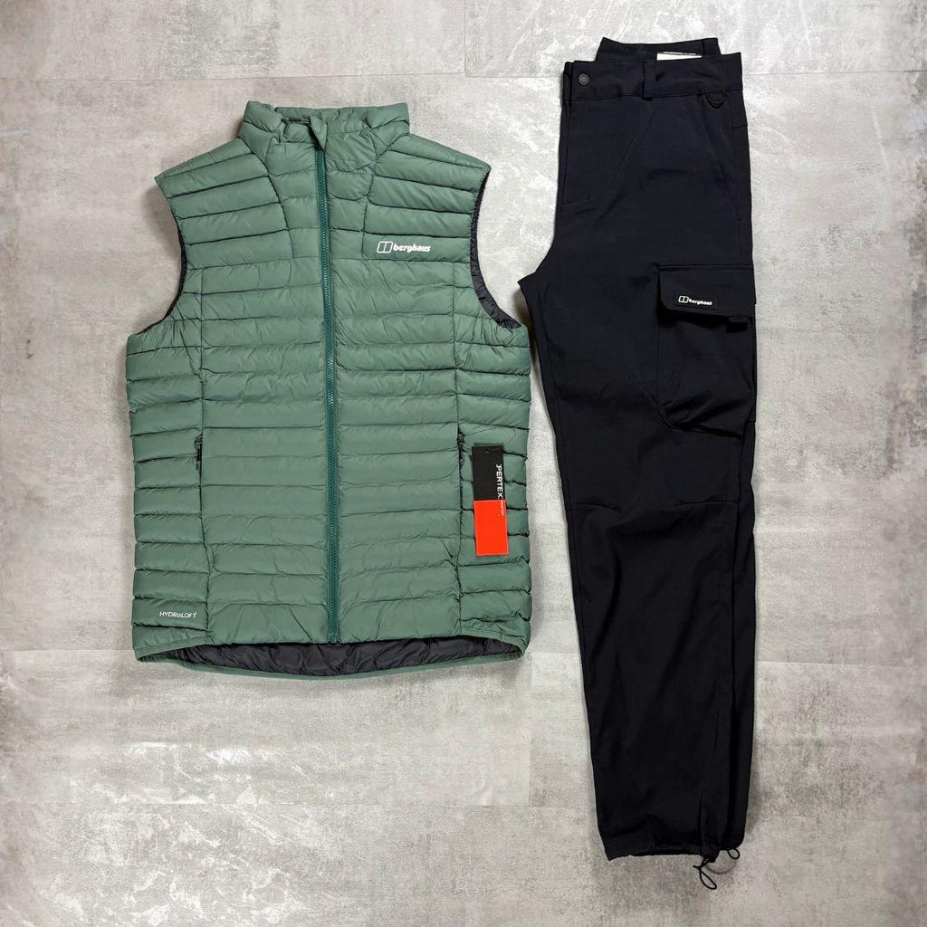 Berghaus Green Vaskye Gilet & Cargo Pant Tracksuit for men, flat lay on a grey concrete surface of the green quilted gilet with matching black cargo pant