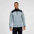 Man wearing a gray and black pullover with a Berghaus logo on a white background