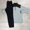 Light gray and black pullover with a Berghaus logo on a light gray background