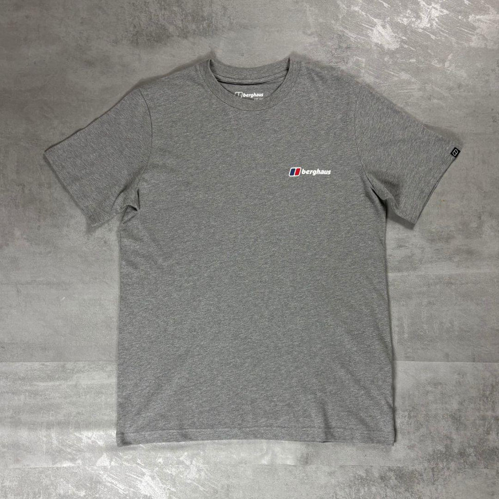Berghaus Grey Class Logo T-Shirt for men, flat lay on a grey concrete surface of the grey marl crew neck tee with small Berghaus logo on the chest and woven tab on the sleeve