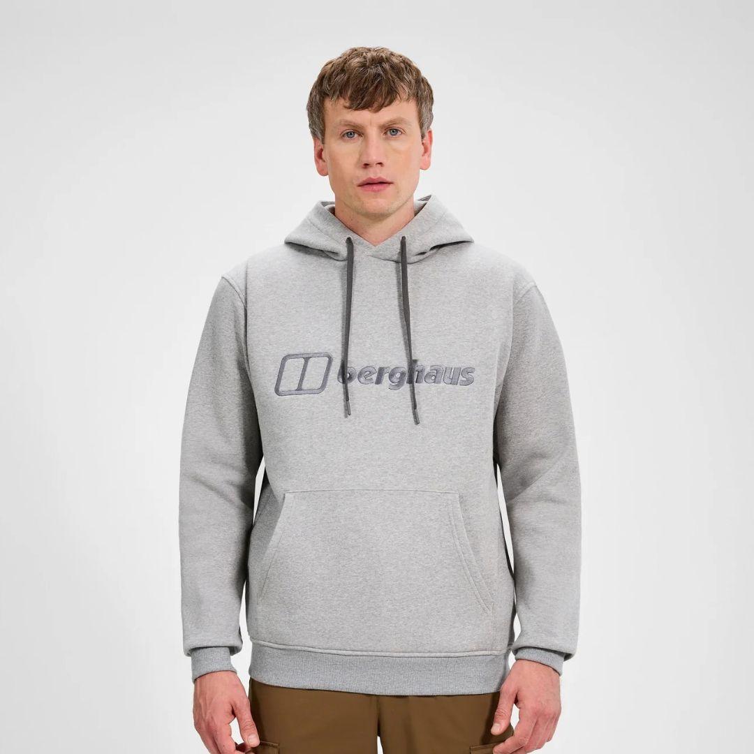 Berghaus Grey Logo Hoodie for men, front view on model of marl grey pullover hoodie with drawcord hood, ribbed cuffs and hem and embroidered Berghaus logo across the chest