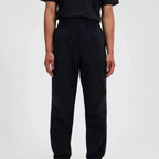 Berghaus Black Explorer Pant for men, front view on model of black performance trouser with adjustable waistband, part of the Grey Logo Hoodie and Pant Tracksuit