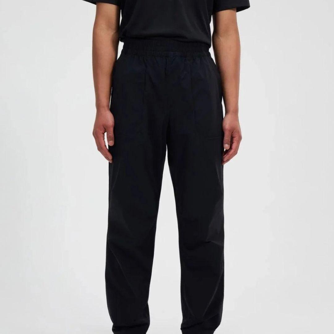 Berghaus Black Explorer Pant for men, front view on model of black performance trouser with adjustable waistband, part of the Grey Logo Hoodie and Pant Tracksuit