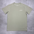 Green t-shirt with a Berghaus logo on a gray surface