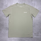 Green t-shirt with a Berghaus logo on a gray surface