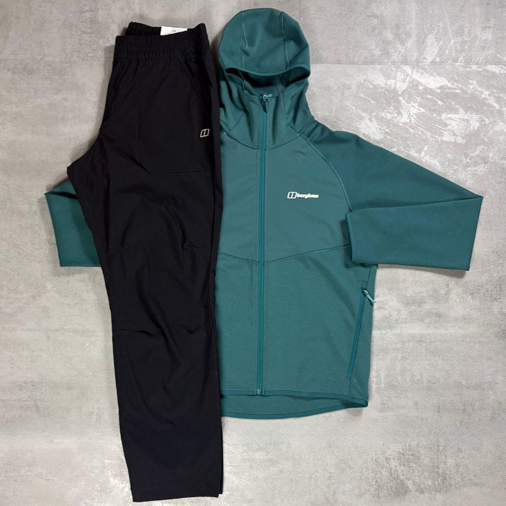 Berghaus Teal Trawden Jacket and Pant Tracksuit for men, flat lay of teal full-zip insulated jacket with adjustable hood and matching black Explorer pant with adjustable waistband
