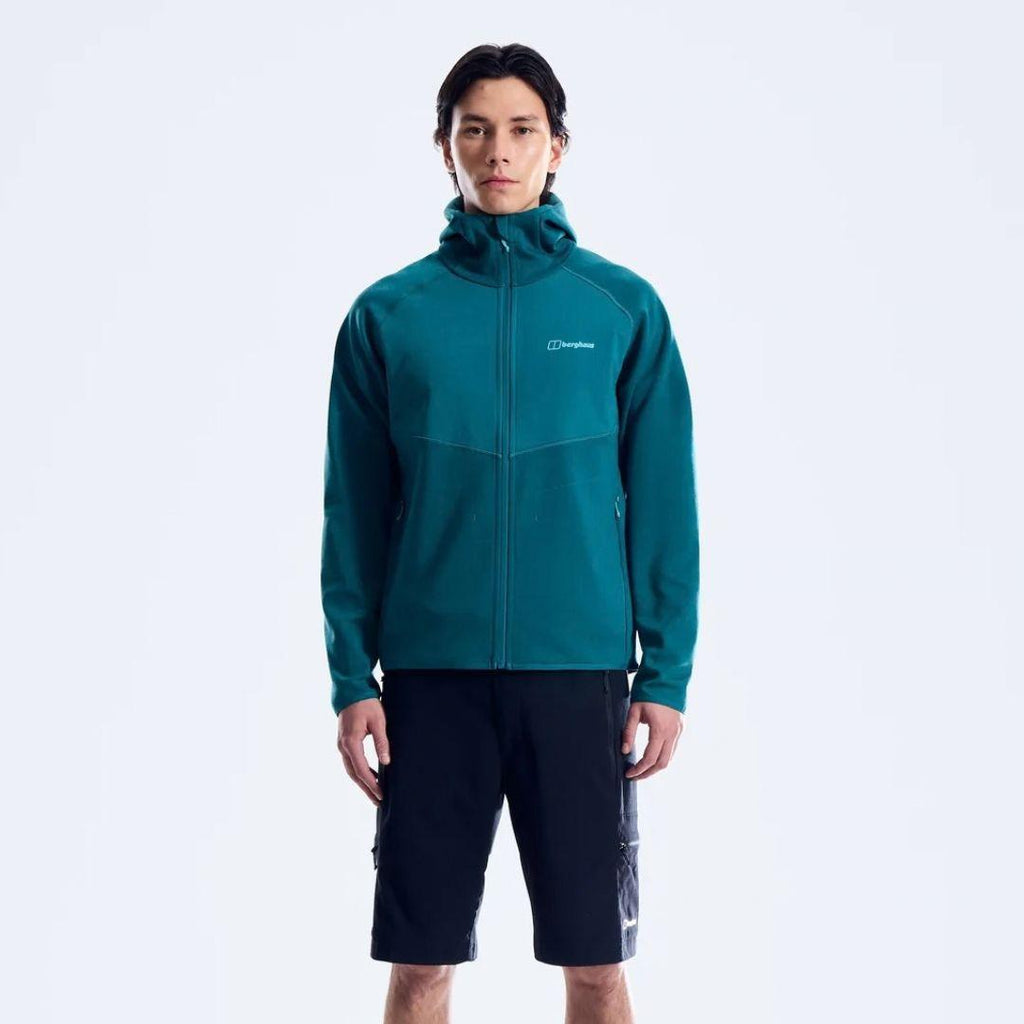 Berghaus Teal Trawden Jacket for men, side view on model showing the full-zip fastening and adjustable hood, part of the Teal Trawden Jacket and Pant Tracksuit