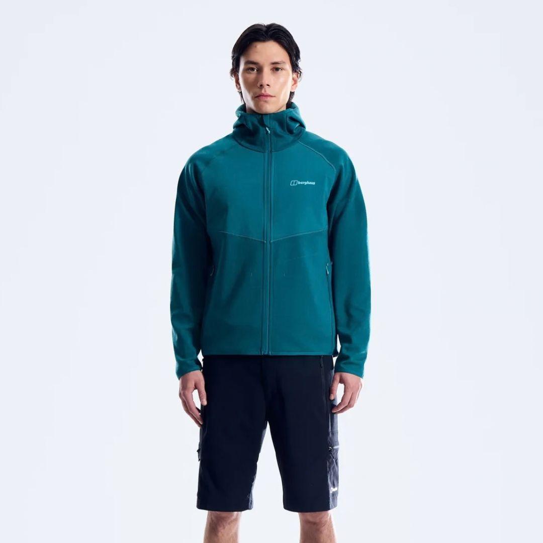 Berghaus Teal Trawden Jacket for men, side view on model showing the full-zip fastening and adjustable hood, part of the Teal Trawden Jacket and Pant Tracksuit