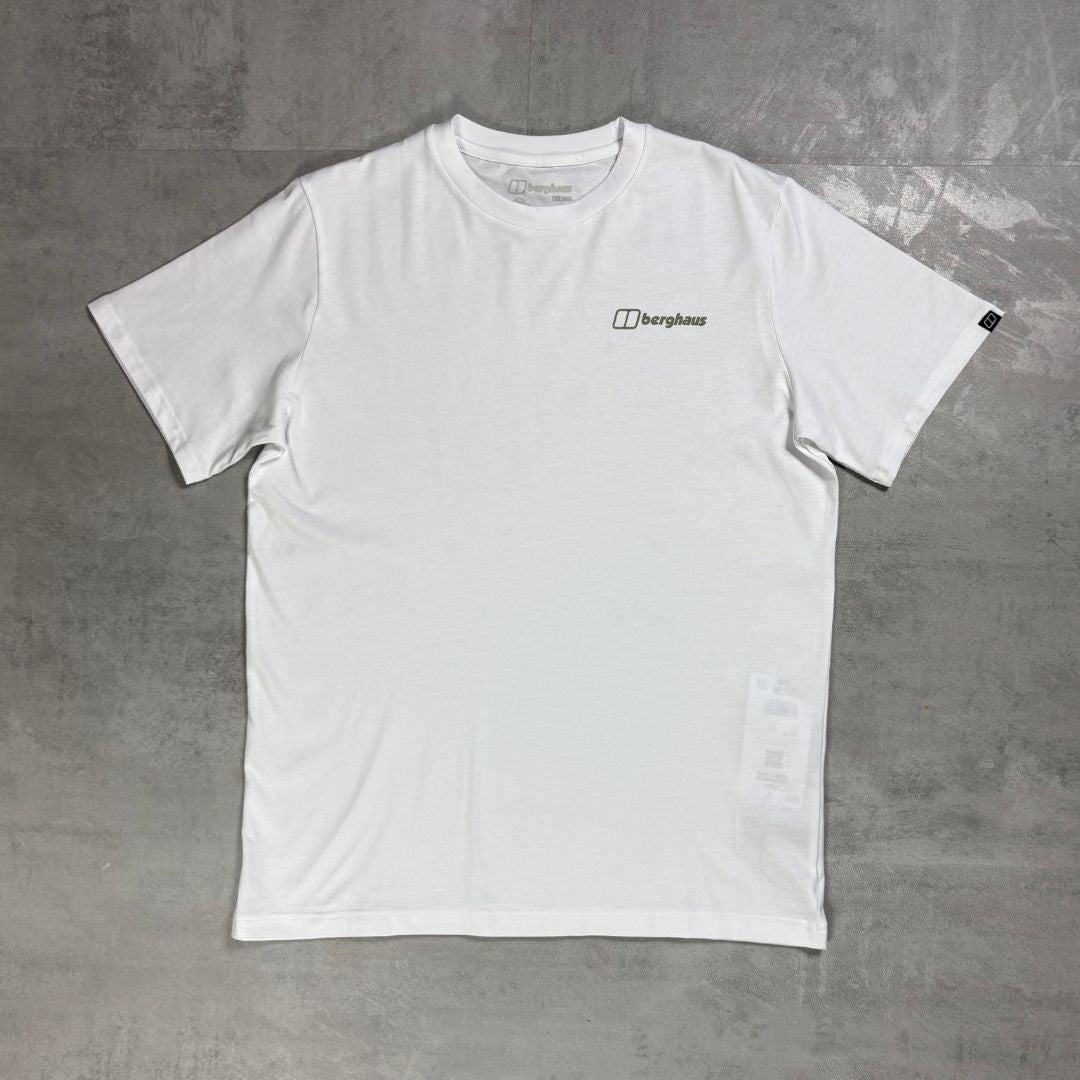 A white short-sleeve crewneck t-shirt with a small black 'berghaus' logo printed on the left chest, laid flat on a textured gray concrete surface.