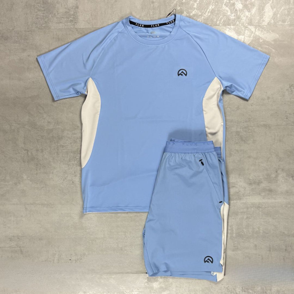 Flux Light blue athletic shirt and shorts set on a grey surface