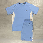 Flux Light blue athletic shirt and shorts set on a grey surface