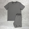 Gray athletic shirt and shorts set with 'Flux' branding on a textured gray background