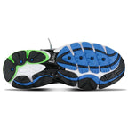 Close-up of a running shoe sole with black, blue, and green design on a white background