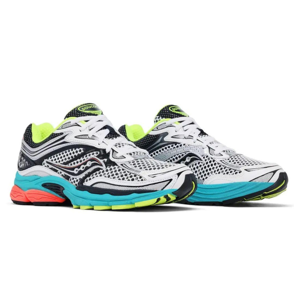 A pair of Saucony athletic running shoes in white, black, and gray, featuring a bright turquoise midsole, neon yellow-green accents, and a small coral-pink accent on the heel.