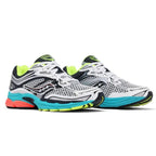 A pair of Saucony athletic running shoes in white, black, and gray, featuring a bright turquoise midsole, neon yellow-green accents, and a small coral-pink accent on the heel.