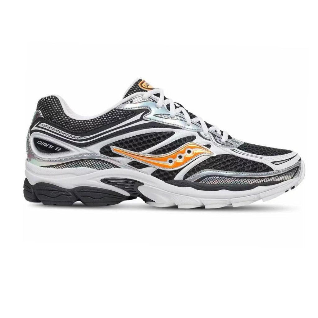 A Saucony Progrid 9 running shoe in black, white, and silver with a distinctive orange logo on the side, shown against a plain white background.