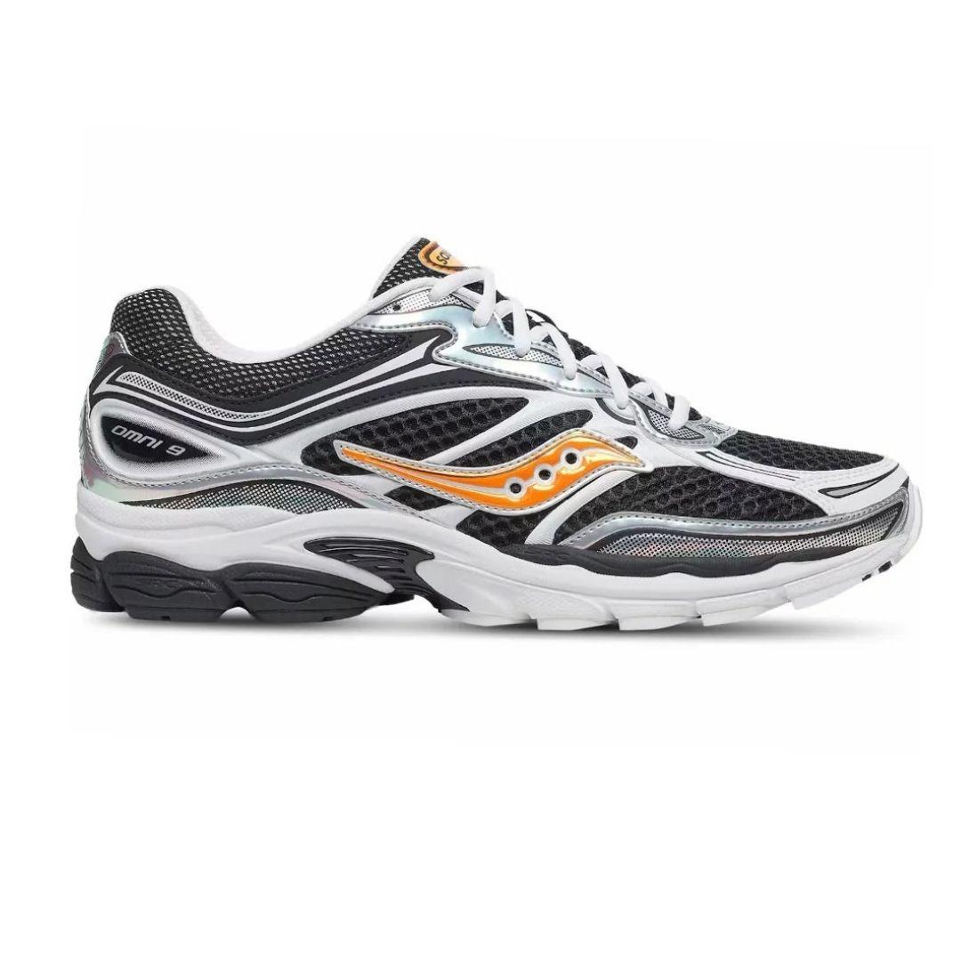 A Saucony Progrid 9 running shoe in black, white, and silver with a distinctive orange logo on the side, shown against a plain white background.